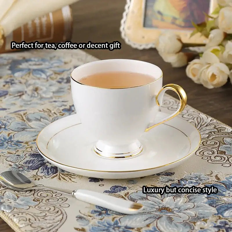Elegant white and gold bone china coffee set featuring a porcelain teacup and matching saucer for tea or coffee