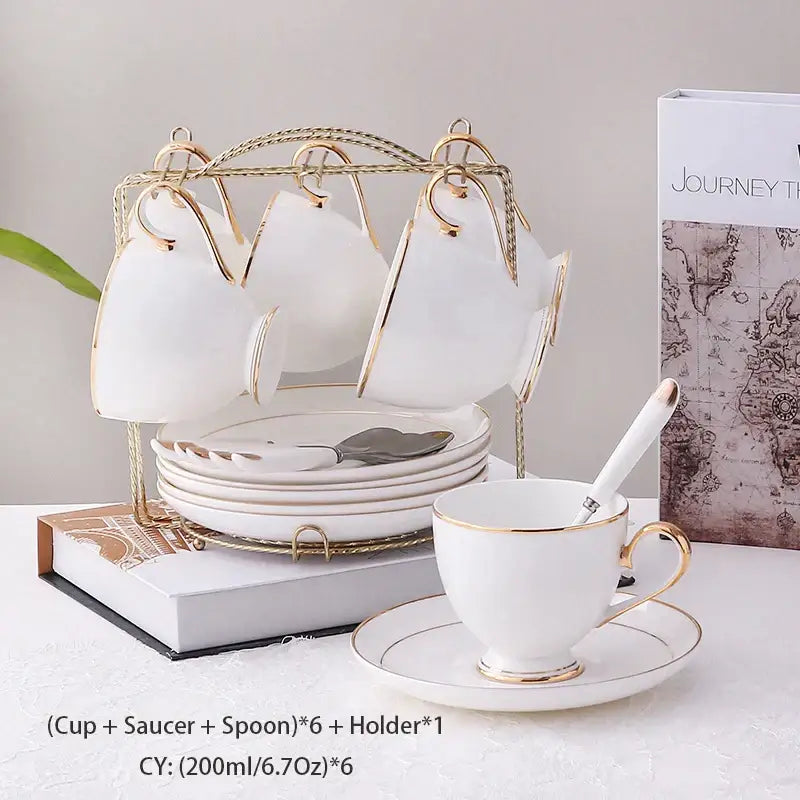 Elegant white and gold bone china coffee set with porcelain teacups and saucers displayed on a golden stand