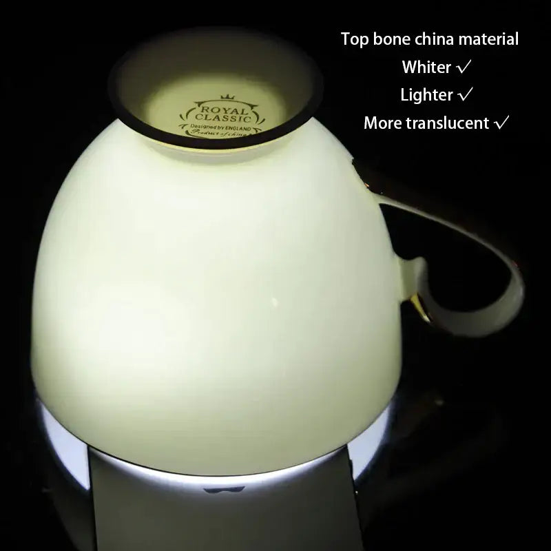 A creamy white and gold bone china teacup with royal classic logo from decorbites elegant bone tea set collection