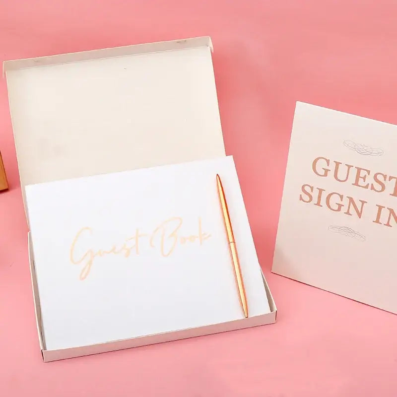 Elegant white decorbites guest book with gold foil bronzing detail in a matching box with rose-gold pen for weddings