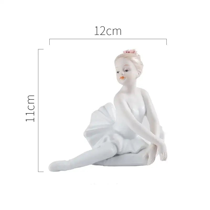Elegant white porcelain ballet girl figurine seated gracefully with a soft pink flower for bedroom decor