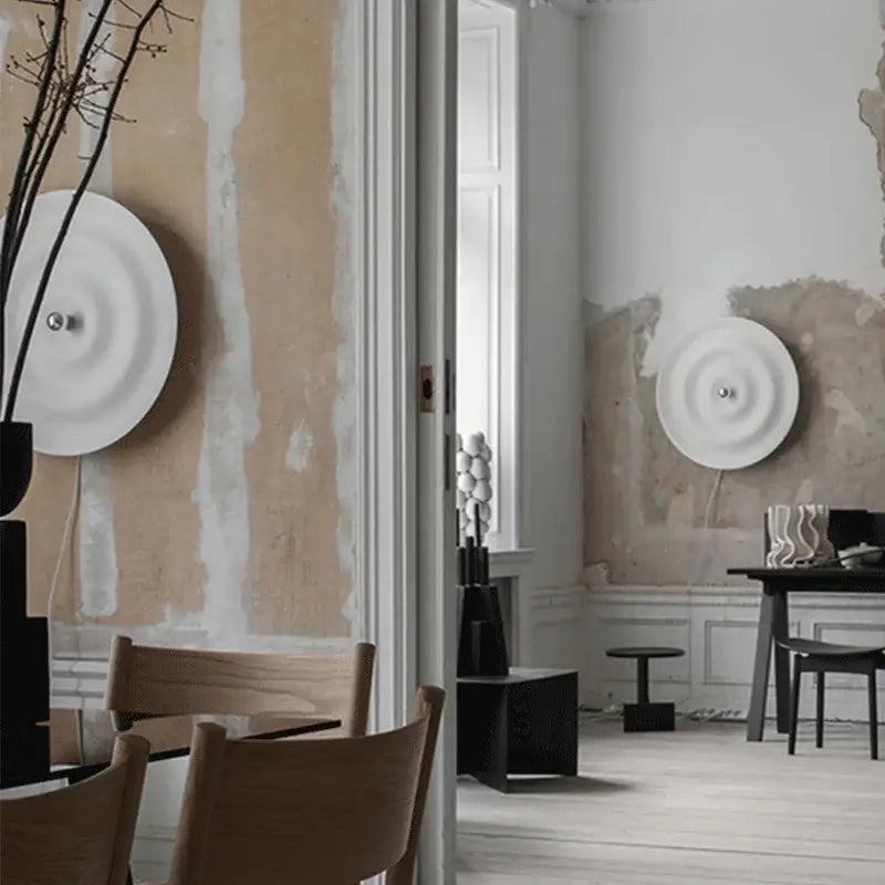 Elegant white ripple led wall sconce with concentric rings and central metallic fixture by decorbites elegant led for bedroom decor
