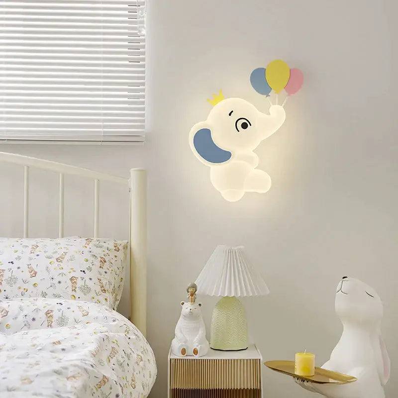 Elephant cartoon wall light with soft glowing fixture and blue ear accents for baby room use