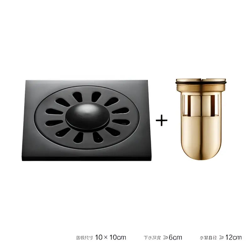 Black brass square floor drain with embossed floral sunburst pattern and gold-toned overflow pipe for shower room decorbites brass square