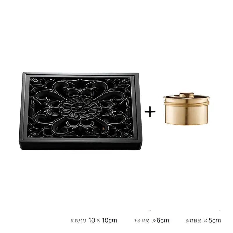 Black lacquered wooden box with floral carvings and golden container beside decorbites brass square floor drain for shower room