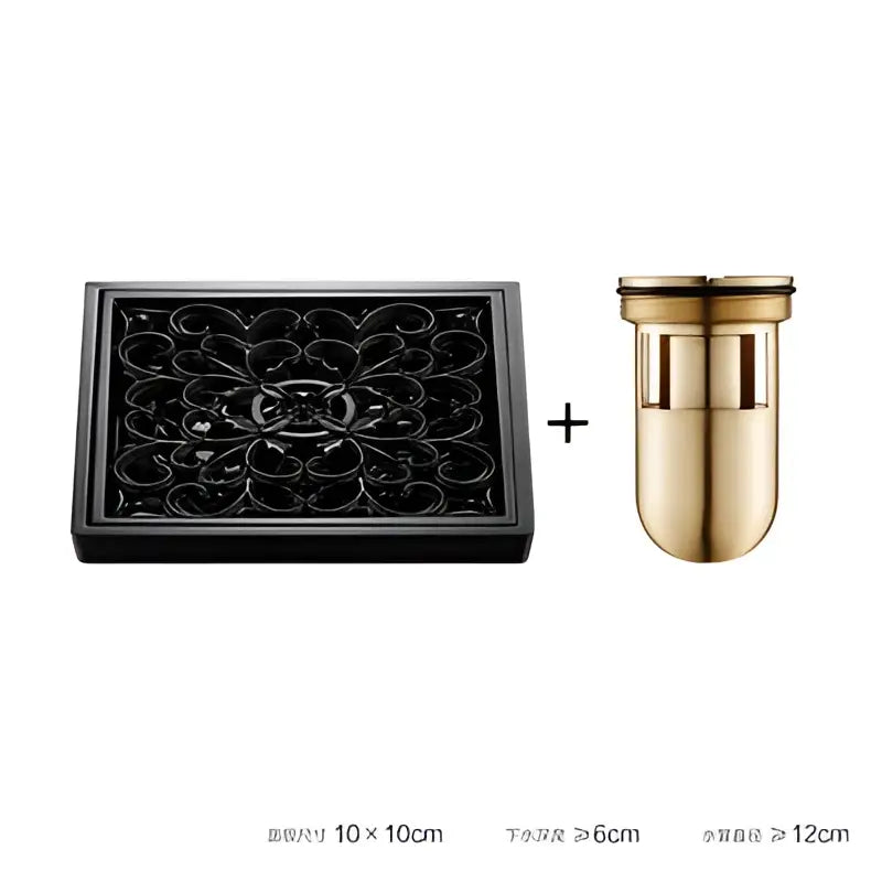 Black ornate metal tray with gold-toned cylindrical container beside embossed floral black brass square floor drain for shower room decorbites brass square