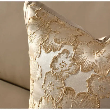 Cream-colored satin cushion cover with embossed floral gold embroidery for champagne gold living room decorbites decor