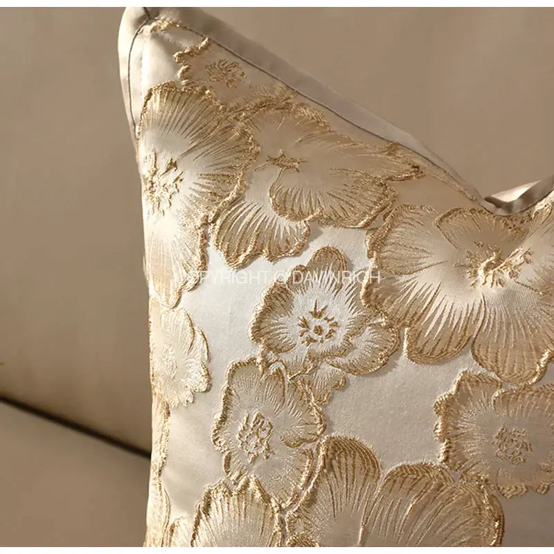 Cream-colored satin cushion cover with embossed floral gold embroidery for champagne gold living room decorbites decor