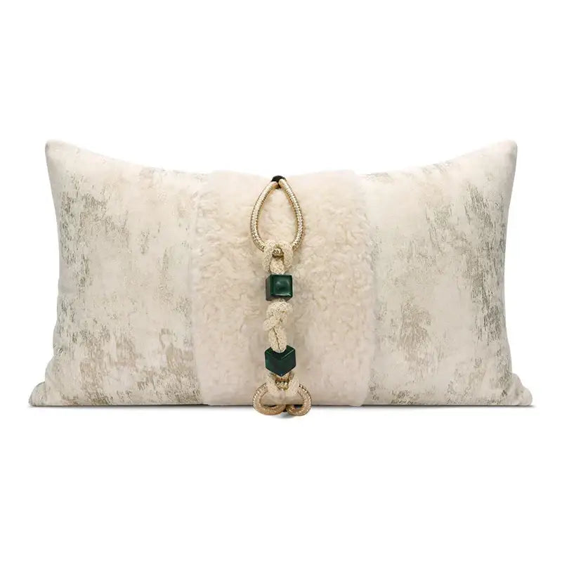 Cream-colored velvet cushion cover with embossed floral texture and central tassel for champagne gold living room decorbites decor