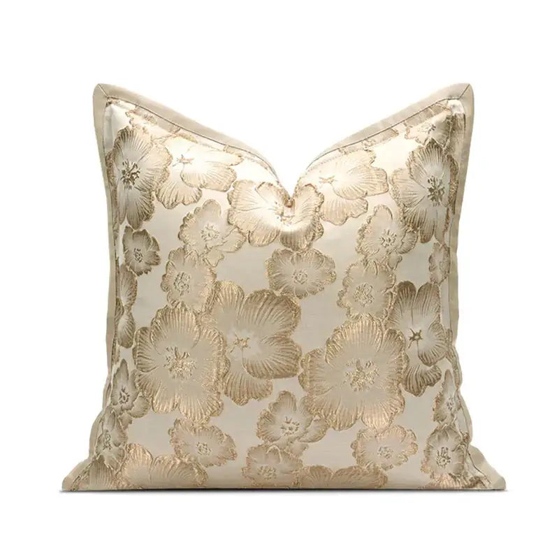 Cream-colored cushion cover with raised gold floral embroidery for elegant living room decor by Decorbites embossed floral