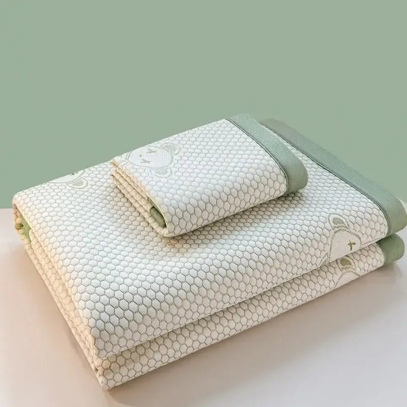 Off-white cotton cooling feel mat set with honeycomb pattern and embroidered bear faces on corners for bedroom use
