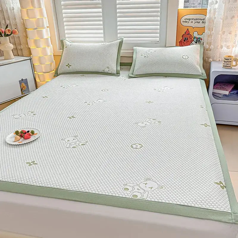 Light green and white patterned cooling feel mat set with embroidered teddy bear designs for bedroom mattress