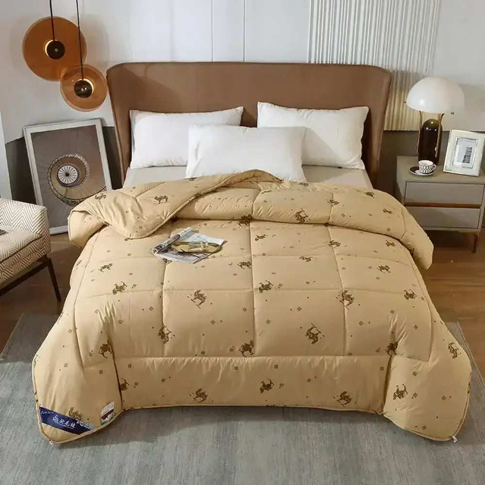 Beige camel hair quilted blanket with stitched squares featuring brown horse silhouettes and small dot pattern decorbites camel hair