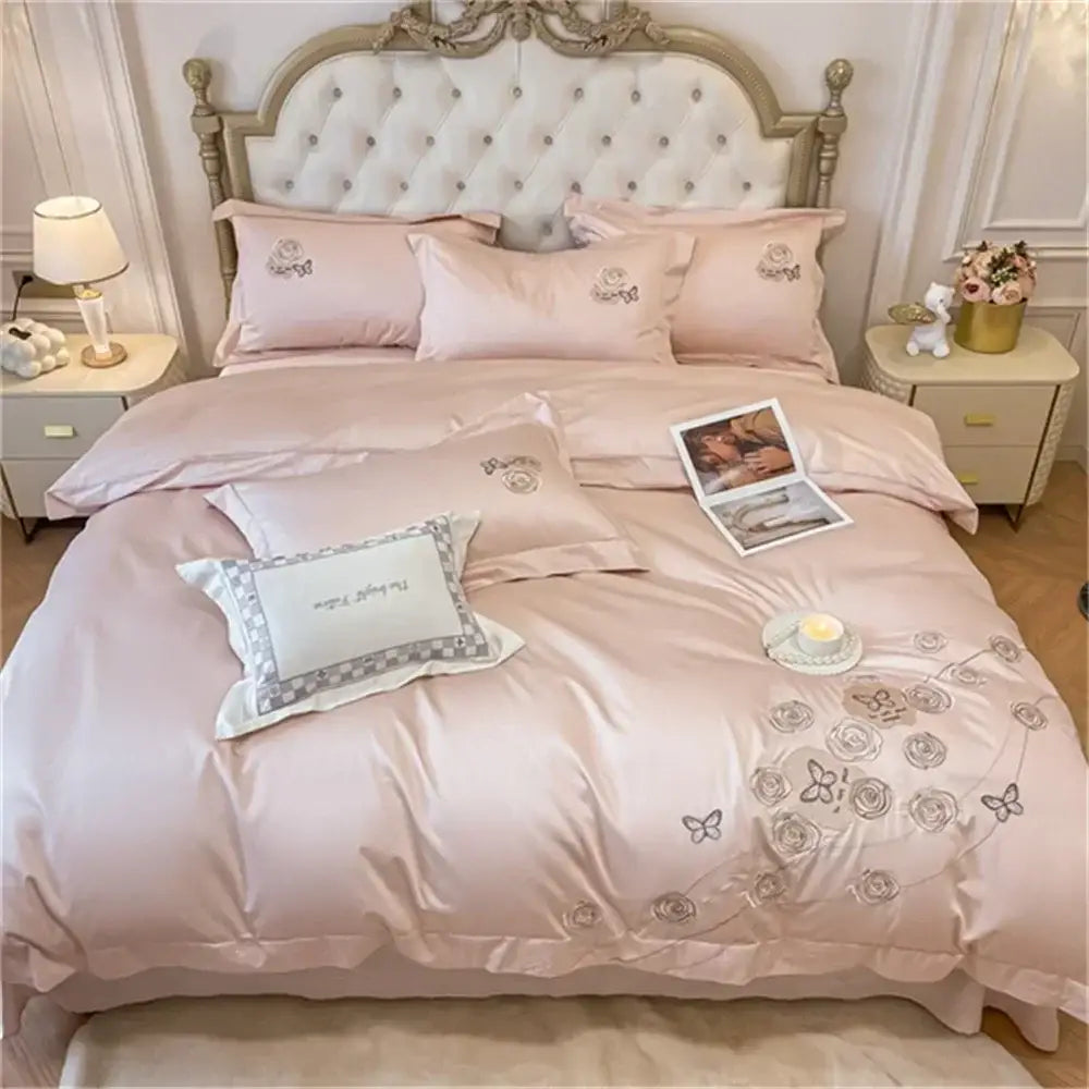 Pink satin duvet cover set with embroidered silver roses and butterflies in egyptian cotton for bedroom use