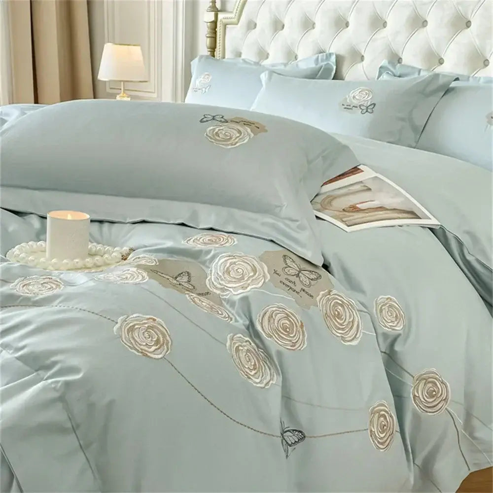 Light blue satin duvet cover set with delicate beige embroidered roses and butterflies made of egyptian cotton