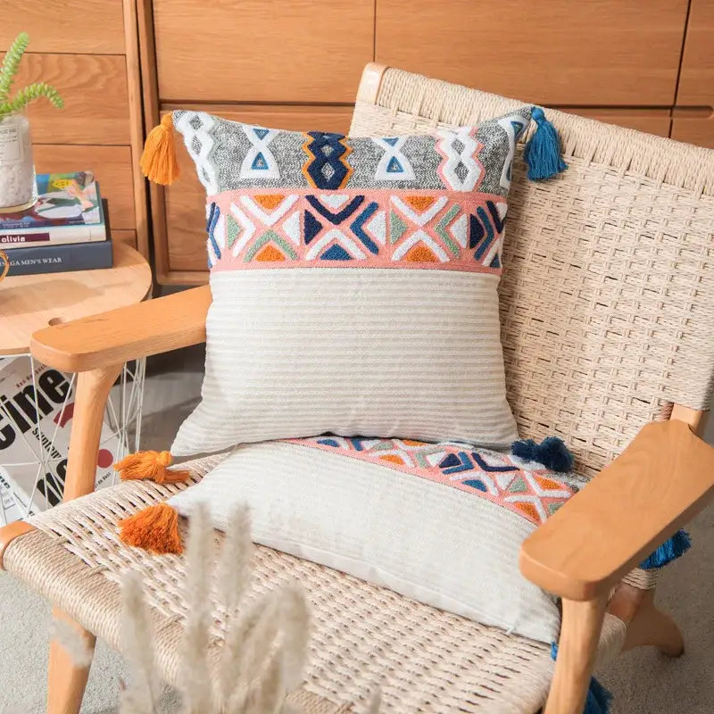 Colorful embroidered blue tufted pillow cover with geometric patterns and tassels for boho bedroom decorbites decor