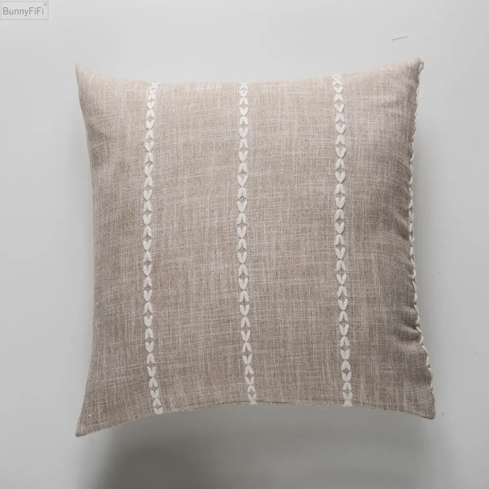 Beige linen throw pillow with cream stitched leaf patterns featuring brown grey stripe embroidery for decorbites living room decor