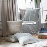 Beige and light gray linen throw pillows with subtle woven patterns featuring decorbites brown grey stripe embroidery for living room decor