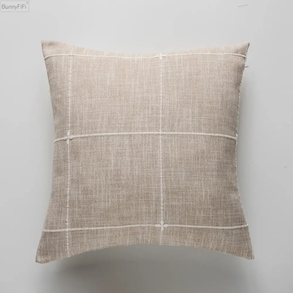 Beige linen cushion with subtle white grid pattern featuring grey stripe embroidery for decorbites brown grey stripe decor