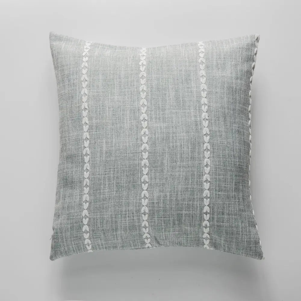 Gray linen throw pillow with three vertical rows of white leaf embroidery in decorbites brown grey stripe cushion cover