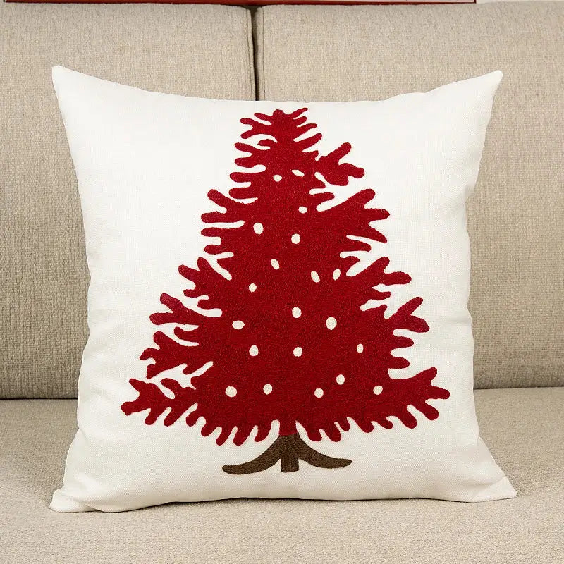 White cushion cover featuring a red felt embroidered christmas tree with white polka dots by decorbites for living room decor