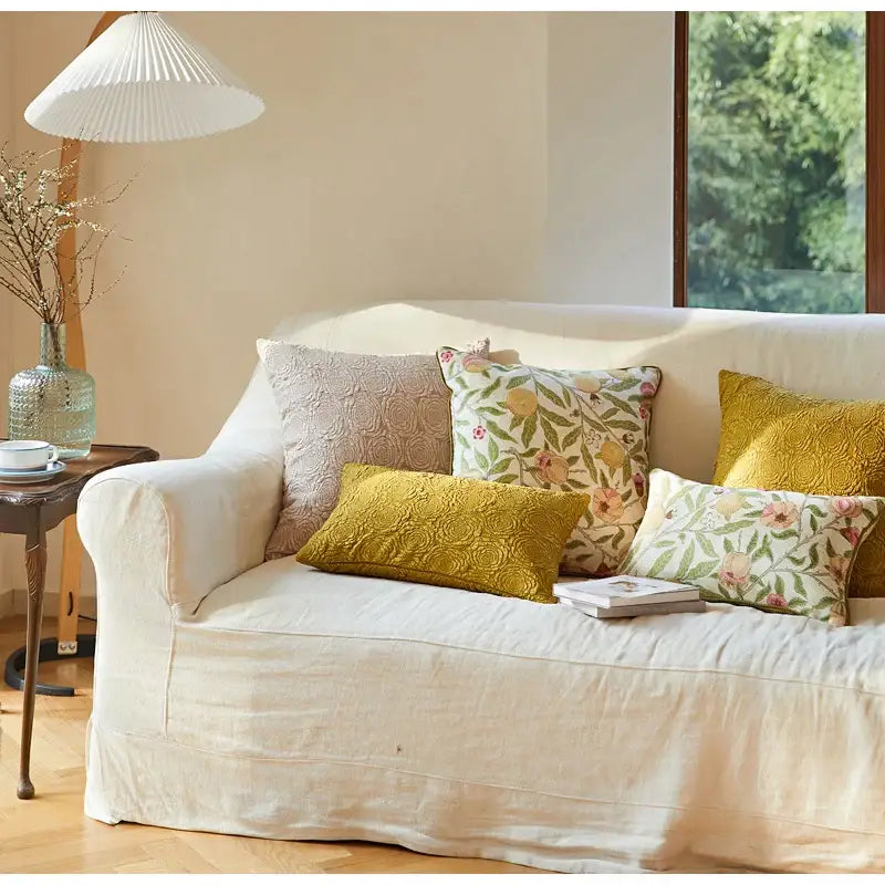 Cream-colored linen sofa with decorbites citron flowers embroidered pillow case featuring citron flowers plants design