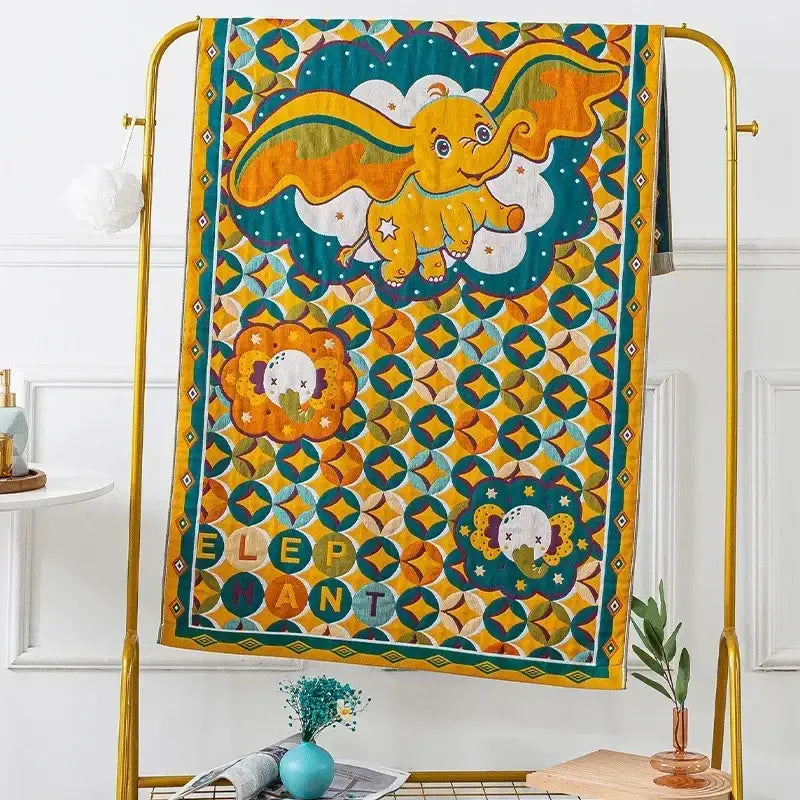 Embroidered cream fruit cotton gauze bath towels featuring a vibrant yellow and teal quilt with a cartoon dumbo elephant decorbites cotton gauze bath