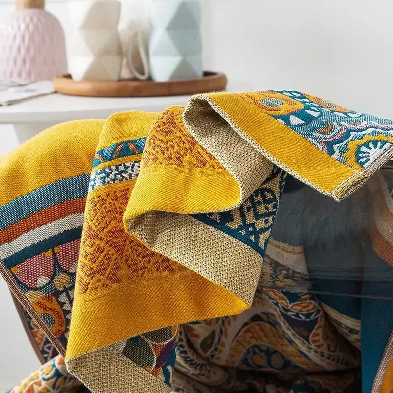 Vibrant yellow embroidered cream fruit cotton gauze bath towels with intricate teal orange and beige patterns for decorbites cotton gauze bath