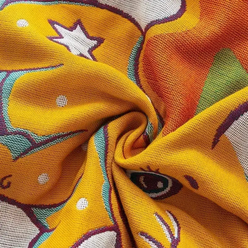 Embroidered cream fruit cotton gauze bath towels with vibrant yellow scarf featuring playful cat design for bathroom decor