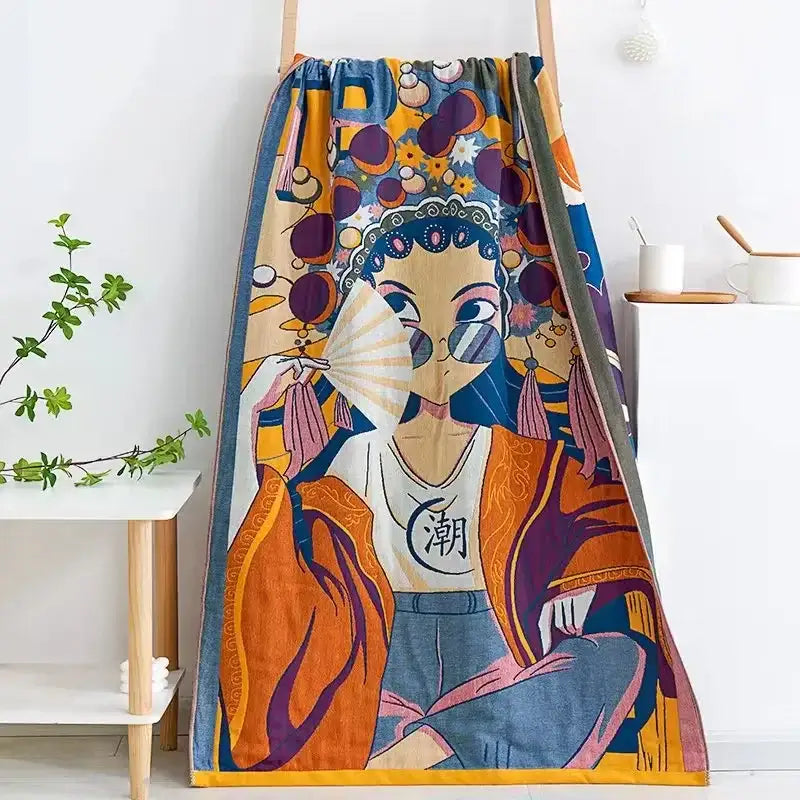 A vibrant cream embroidered cotton gauze bath towel with a colorful woman holding a fan design for bathroom decor