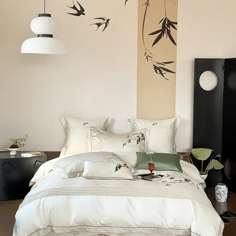 A plush white satin embroidered cream lyocell cotton bedding set with black bird and bamboo decorbites deluxe lyocell pillows