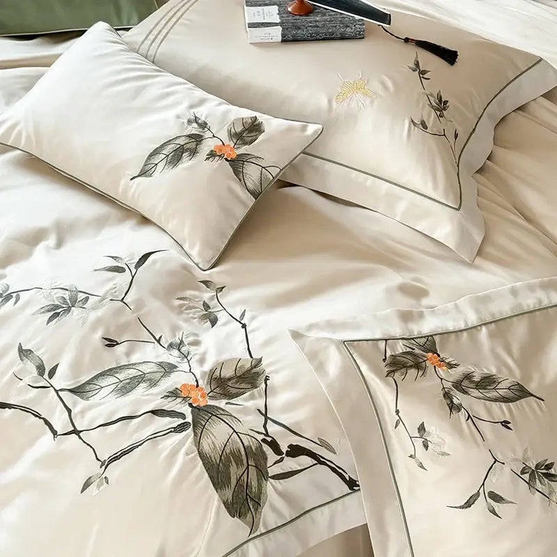 Cream-colored embroidered lyocell cotton bedding set with floral black stems gray leaves orange blossoms for decorbites deluxe lyocell luxury decor