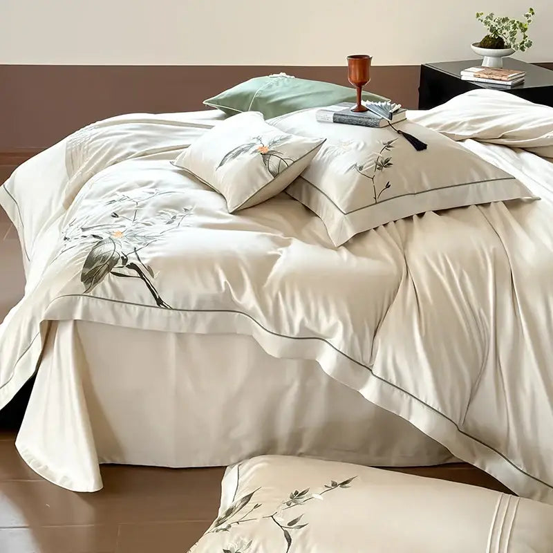 Cream-colored lyocell cotton bedding set with delicate black and gray floral embroidery for decorbites deluxe lyocell decor