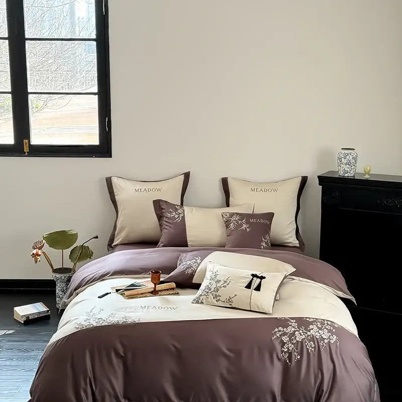 The meadow bedding set in muted purple and cream features delicate white floral embroidery on lyocell cotton for luxury decorbites deluxe lyocell comfort
