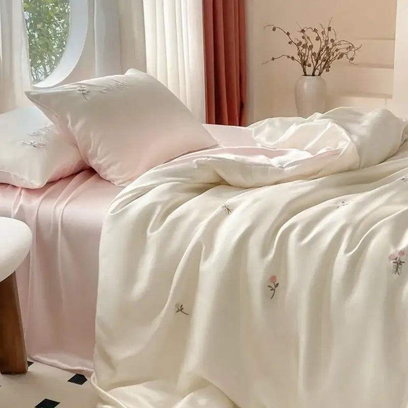 Cream-colored satin duvet cover with delicate pink green floral embroidery in decorbites ice silk bedding sets
