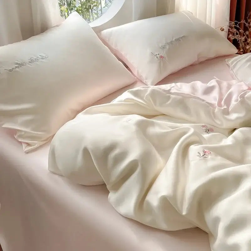 Cream-colored satin ice silk bedding sets with delicate pink floral embroidery for bedroom sleep decorbites ice silk