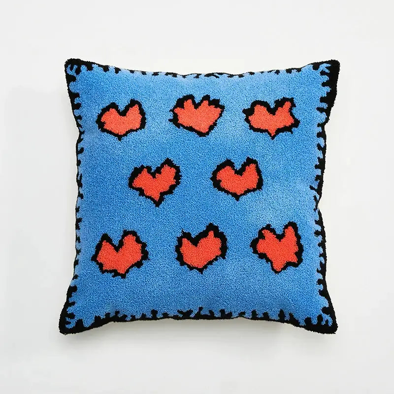 Blue cushion cover with orange hearts and black stitched edges for embroidered daisy dandelion living room decor
