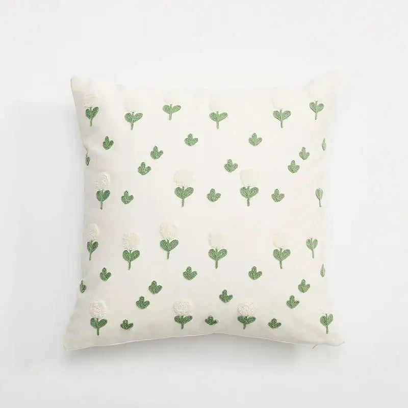 Off-white cushion cover with delicate green embroidered daisy dandelion flowers for white living room decor