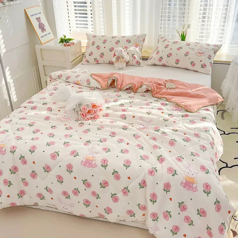 Pink and white floral double gauze rabbit print quilt comforter with embroidered bunny illustrations for bedroom use