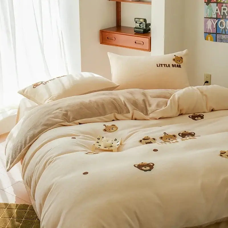 Cream-colored embroidered fleece winter bedding set with teddy bear design and little bear text on pillows