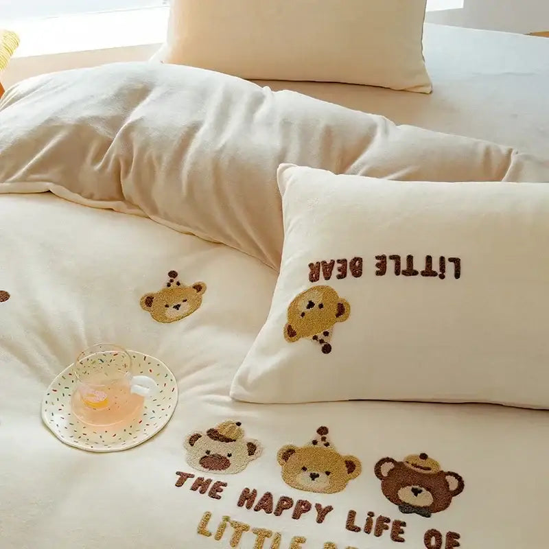 Cream-colored embroidered fleece winter bedding set pillowcase with brown and tan teddy bear faces and little bear text