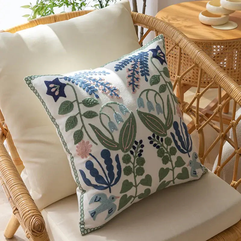 White embroidered floral bird office cushion pillowcase with intricate blue green pink and purple patterns