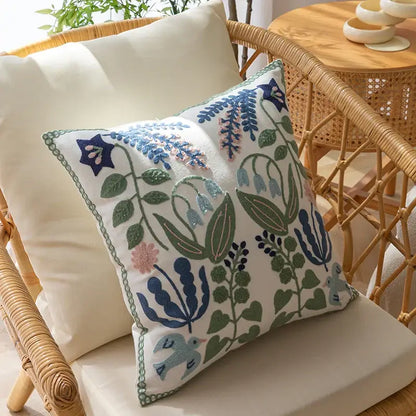 White embroidered floral bird office cushion pillowcase with intricate blue green pink and purple patterns