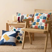 Cozy textured pillow cover with playful geometric pattern in soft pastel and earthy tones for home decor