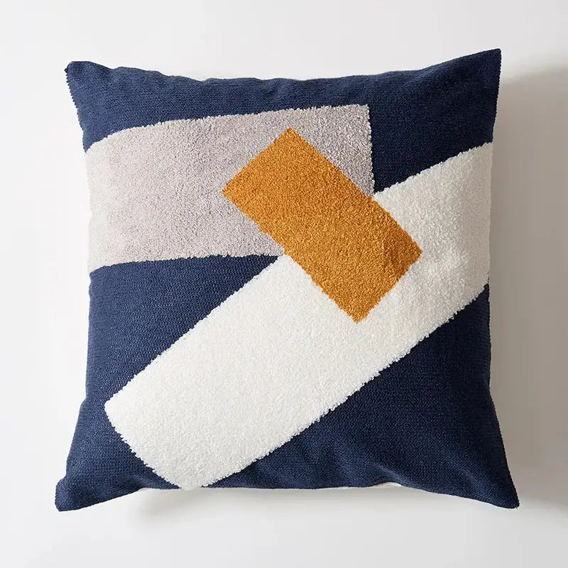 Navy blue pillow cover with embroidered floral dot pattern in white and mustard yellow for home decor