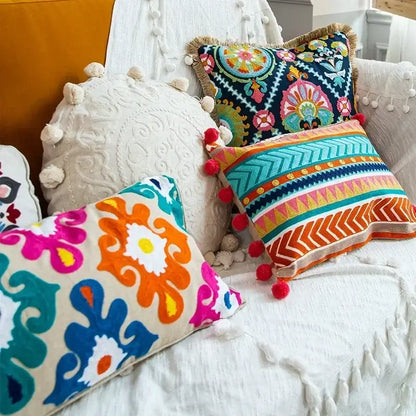 Vibrant embroidered flower boho long cushion covers with bold floral and geometric patterns on dark navy background