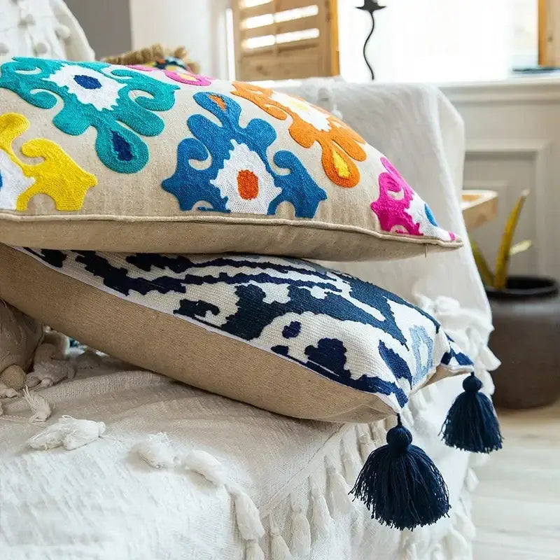 Vibrant embroidered flower boho long cushion cover with colorful floral patterns on beige linen for bedroom use
