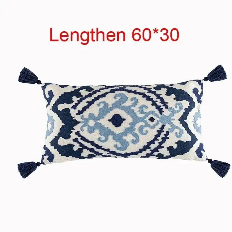 Rectangular flower boho long cushion cover with navy and light blue embroidered ikat pattern and dark blue tassels