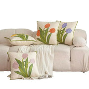 Cream-colored embroidered flower pillowcase cover with tulips in orange purple and pink on textured fabric for living room decor