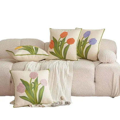 Cream-colored embroidered flower pillowcase cover with tulips in orange purple and pink on textured fabric for living room decor